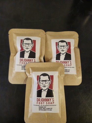 Three 1 oz packs of Dr. Johnny's Foot Soap in kraft paper packets, a pack of 3 foot soak