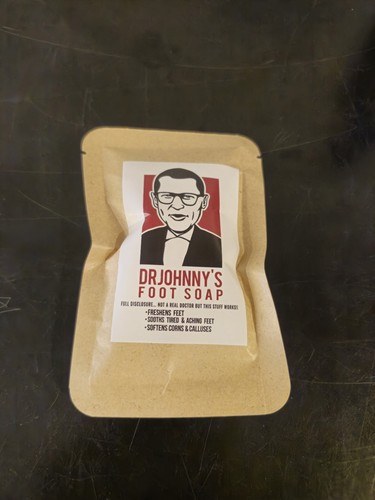 Single 1 oz pack of Dr. Johnny's Foot Soap in a kraft paper packet, an affordable Johnson's Foot Soap alternative